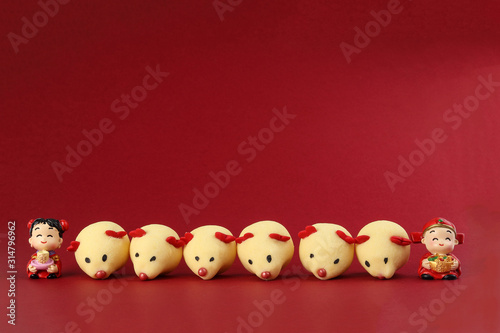 Chinese New Year rat mouse shaped cookie boy girl doll on red background