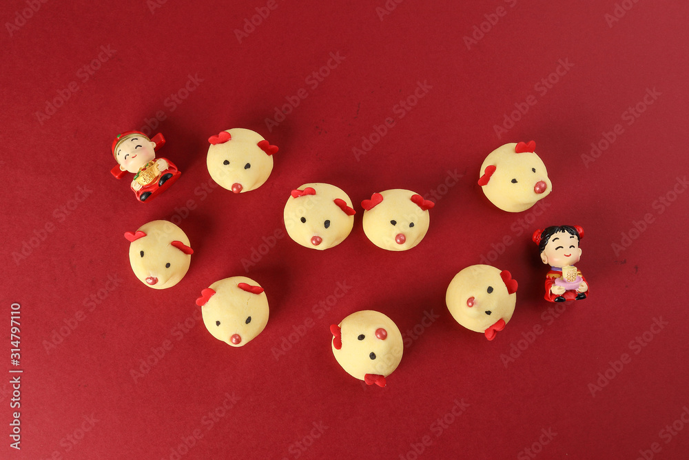 Chinese New Year rat mouse shaped cookie boy girl doll on red background