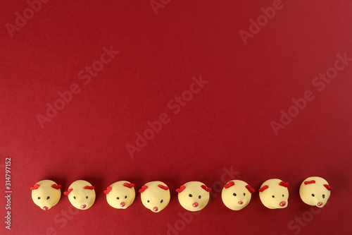 Chinese New Year rat mouse shaped cookie on red background