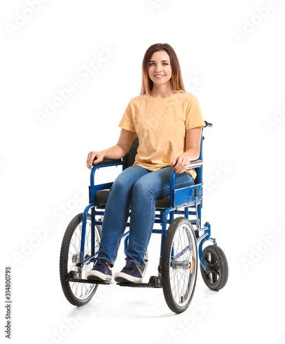 Handicapped young woman in wheelchair on white background