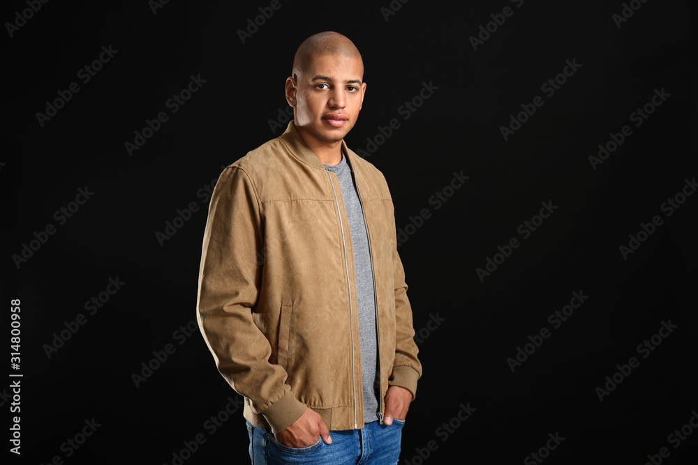 Stylish African-American man on dark background Stylish African-American man on dark background