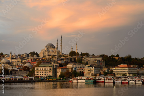 Rustem Pasha and Suleymaniye Mosques with golden sunrise on the waters of the Golden Horn Istanbul © Reimar