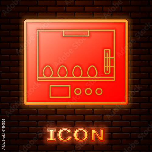 Glowing neon Incubator for eggs icon isolated on brick wall background. Vector Illustration