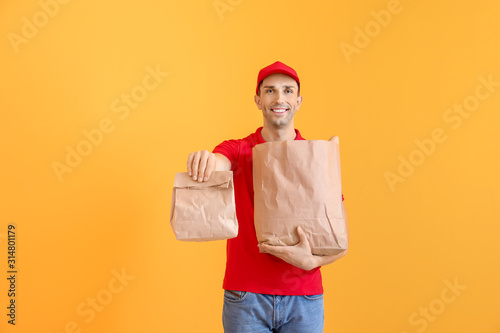 Handsome worker of food del...