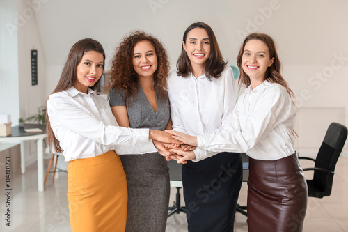 Young women putting hands t...