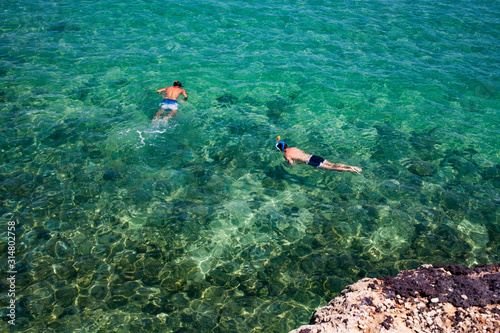 top view of two men snorkeling summer beach holiday