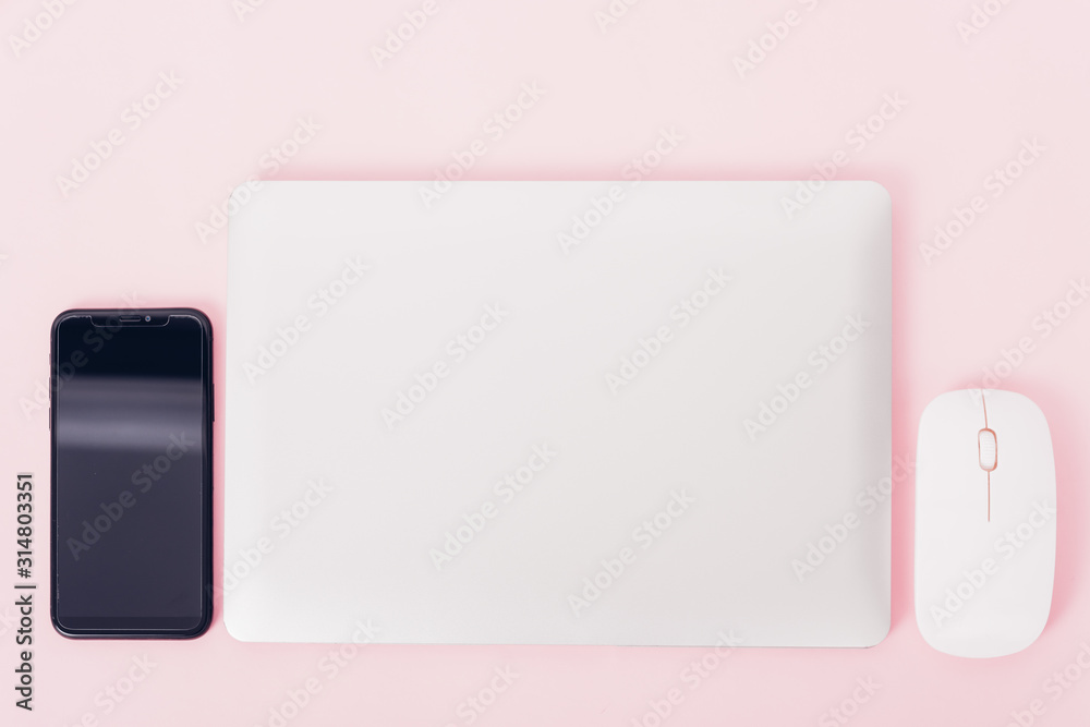 Top view of modern technology smart phone mobile and computer laptop close cover Top view of modern technology smart phone mobile and computer laptop close cover
