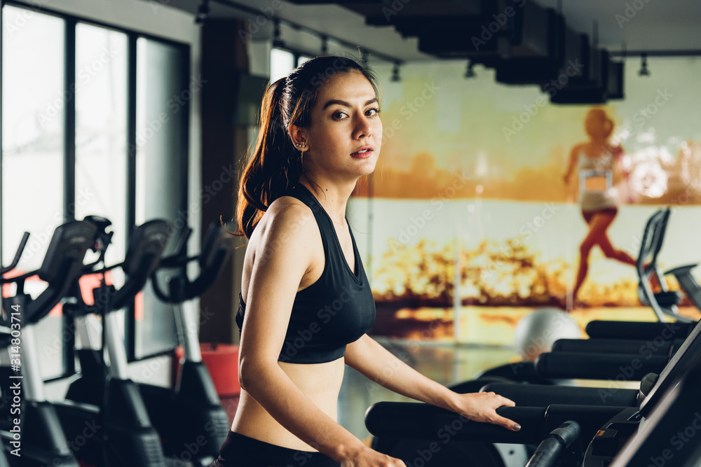 Beautiful woman active running exercise workout on treadmill Beautiful woman active running exercise workout on treadmill