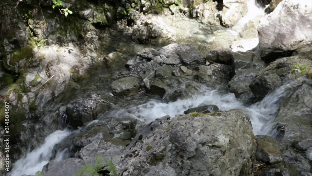 Mountain river water, top view. Crystal clear mountain river. Beautiful nature lansdscape.