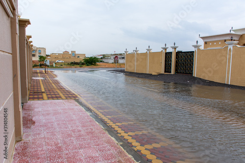 Canvas Print A stormy day in the United Arab Emirates leaves flooding throughout residential areas of the city of Ras al Khaimah and surrounding Emirates