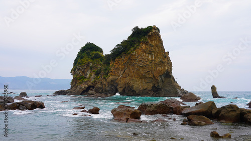 Rocky volcanic islands in turquoise blue water off the coast of Japan Aburatsu. incredible beaches and cliffs on the islands of the Pacific Ocean, Asia