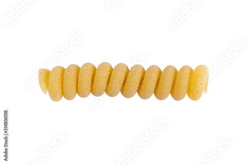 Yellow fusilli pasta isolated on white background. Delicious pasta or fusilli noodles isolated on white. Italian raw noodles. Homemade dry noodles. Spaghetti isolated