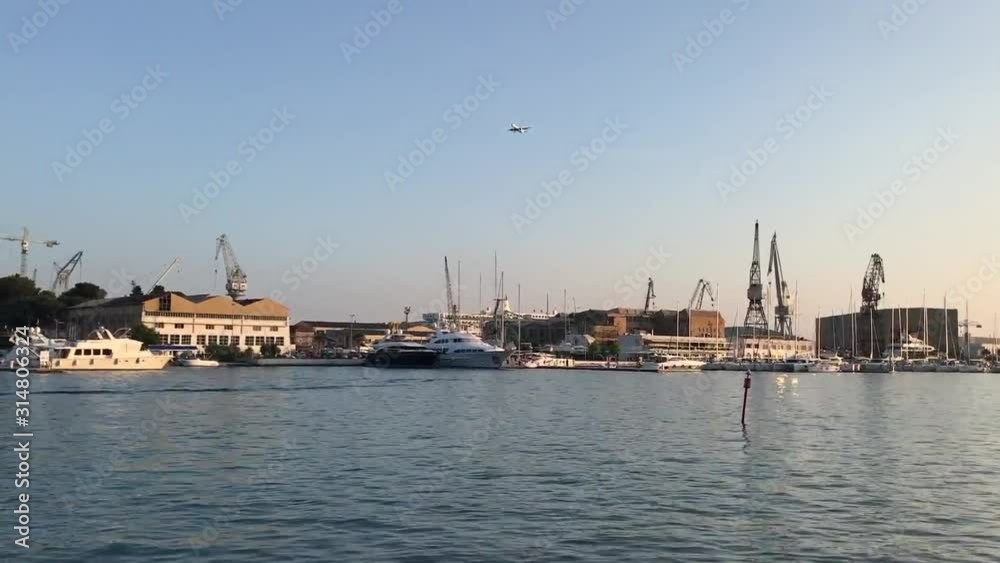 Plane flying over the harbour in croatia. Plane flying over the harbour in croatia.