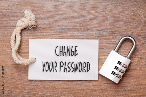 Change your password words written on tag label with combination padlock photo