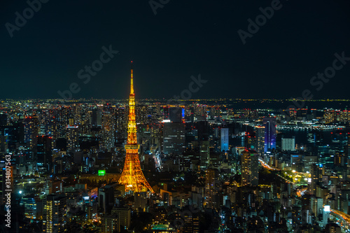 Tokyo Tower,  communications and observation tower in Shiba-koen, Minato and aerial Tokyo cityscape twilight view from Roppongi Hills, a must travel destination in Tokyo