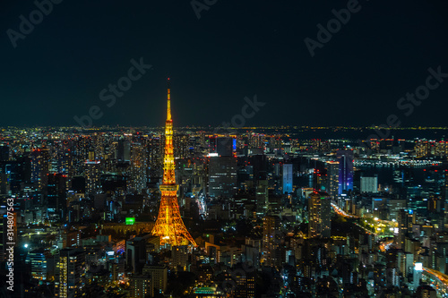 Tokyo Tower   communications and observation tower in Shiba-koen  Minato and aerial Tokyo cityscape twilight view from Roppongi Hills  a must travel destination in Tokyo
