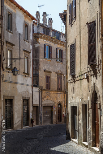 Fototapeta Naklejka Na Ścianę i Meble -  VITERBO / ITALY - JULY 2015: Street in the historic centre of Veterbo town, Italy