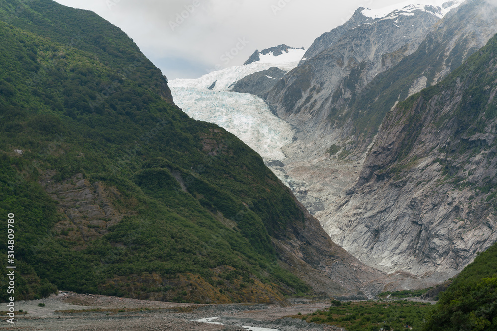 Franz Josef glacier in Fox mountain national park area, New Zealand natural landscape background Franz Josef glacier in Fox mountain national park area, New Zealand natural landscape background