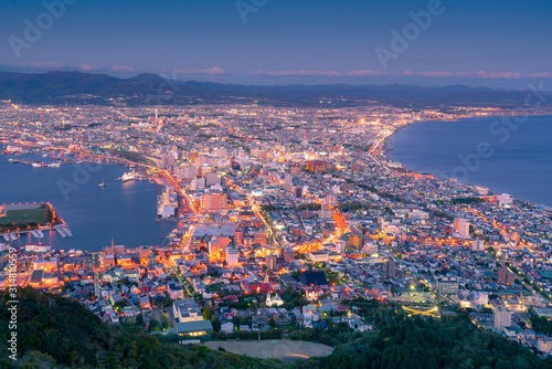 Night life of Hakodate city observation view point from mountain, Japan cityscape background © pranodhm