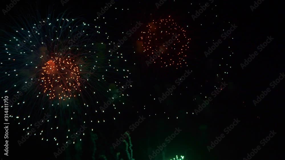 Beautiful abstract colourful Fireworks explode display on sky at night a symbol of celebration in New years anniversary for background