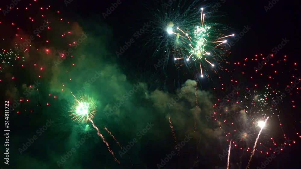 Beautiful abstract colourful Fireworks explode display on sky at night a symbol of celebration in New years anniversary for background