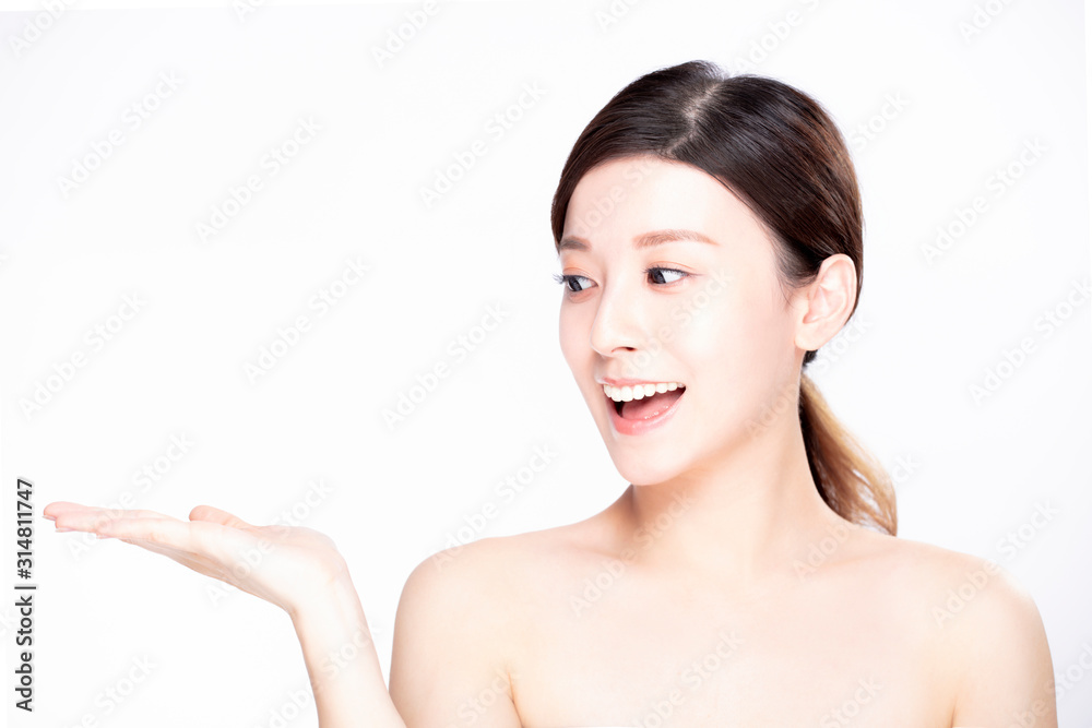 young beauty showing empty copy space on the open hand palm young beauty showing empty copy space on the open hand palm