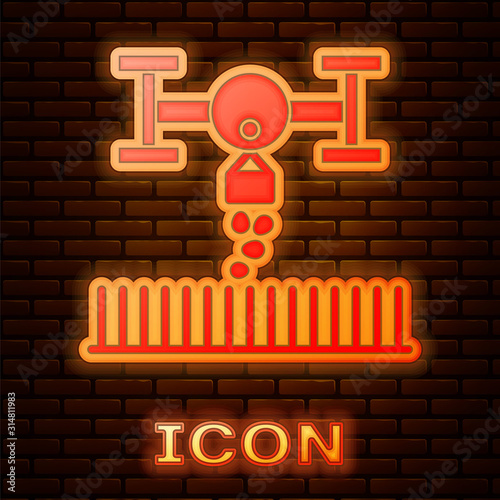 Glowing neon Smart farm with drone control for seed planting icon isolated on brick wall background. Innovation technology for agricultural company. Vector Illustration