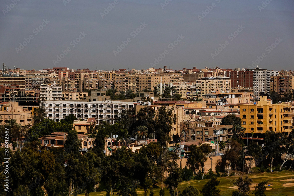 Cairo, Egypt The skyline of Cairo and Giza seen from the grounds of the Pyramids of Giza.