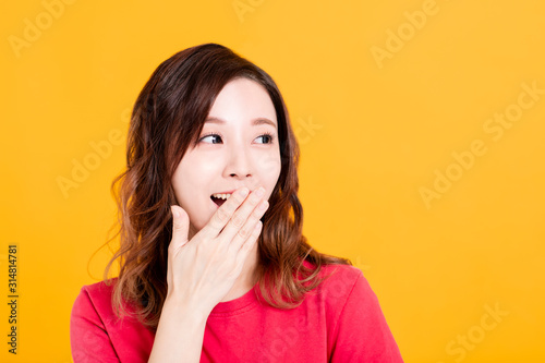 Young beautiful woman thinking looking to the side at blank copy space