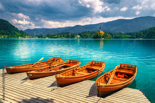 Traditional wooden rowboats anchored on the lake Bled, Slovenia