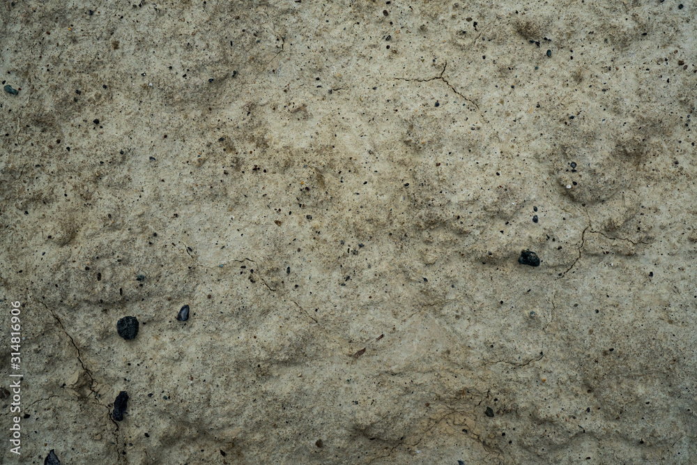 Fototapeta premium Texture of dried cracked clay. Macro background image of dried clay