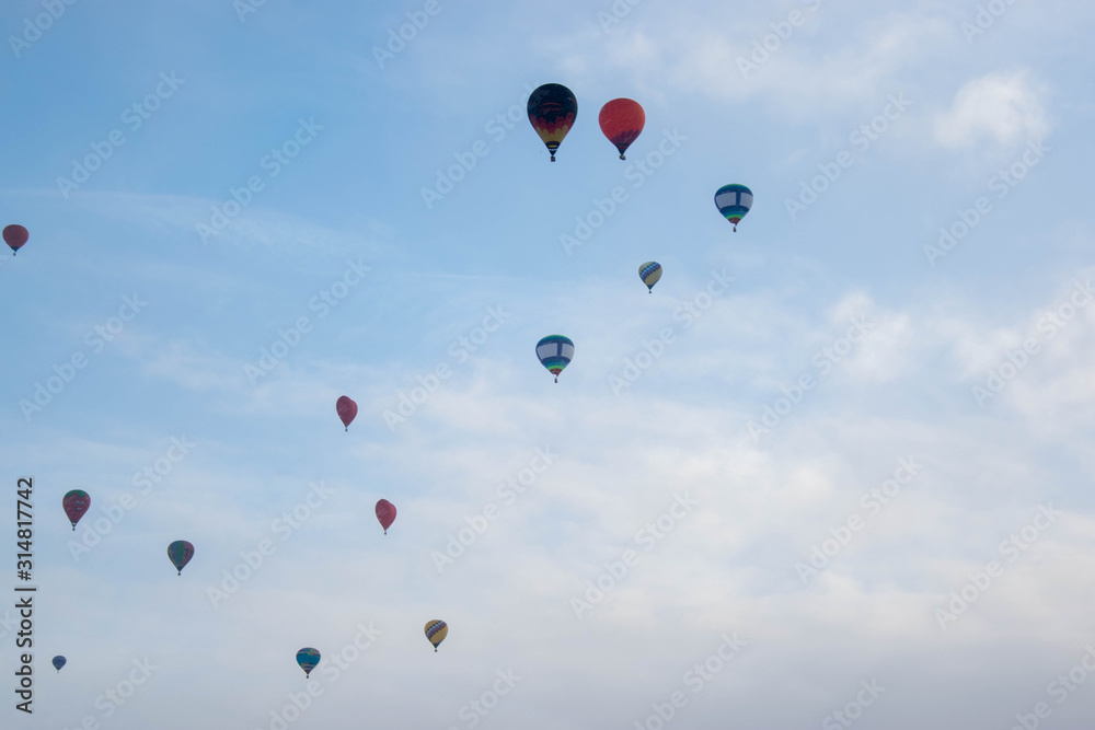 The hot air baloons fest in Russia. Apples on the snow. Colorfull balloons in the winter skye The hot air baloons fest in Russia. Apples on the snow. Colorfull balloons in the winter skye