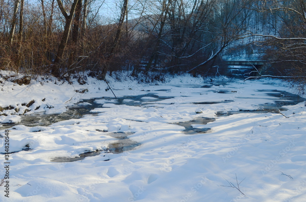 Fototapeta premium Winter landscape with the river and in frosty day