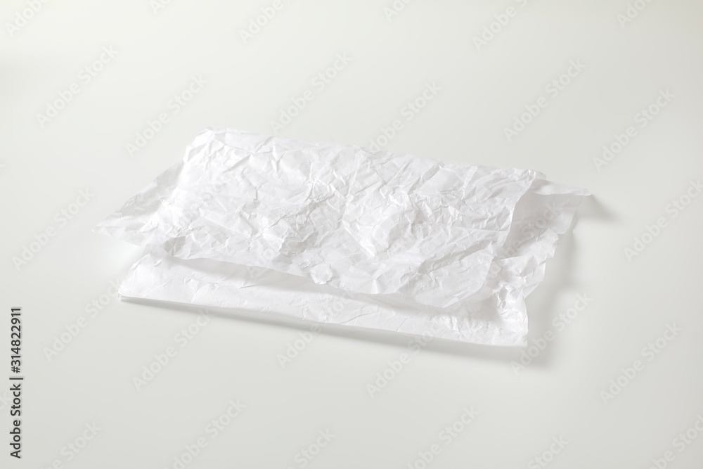 Crumpled white waxed packing paper
