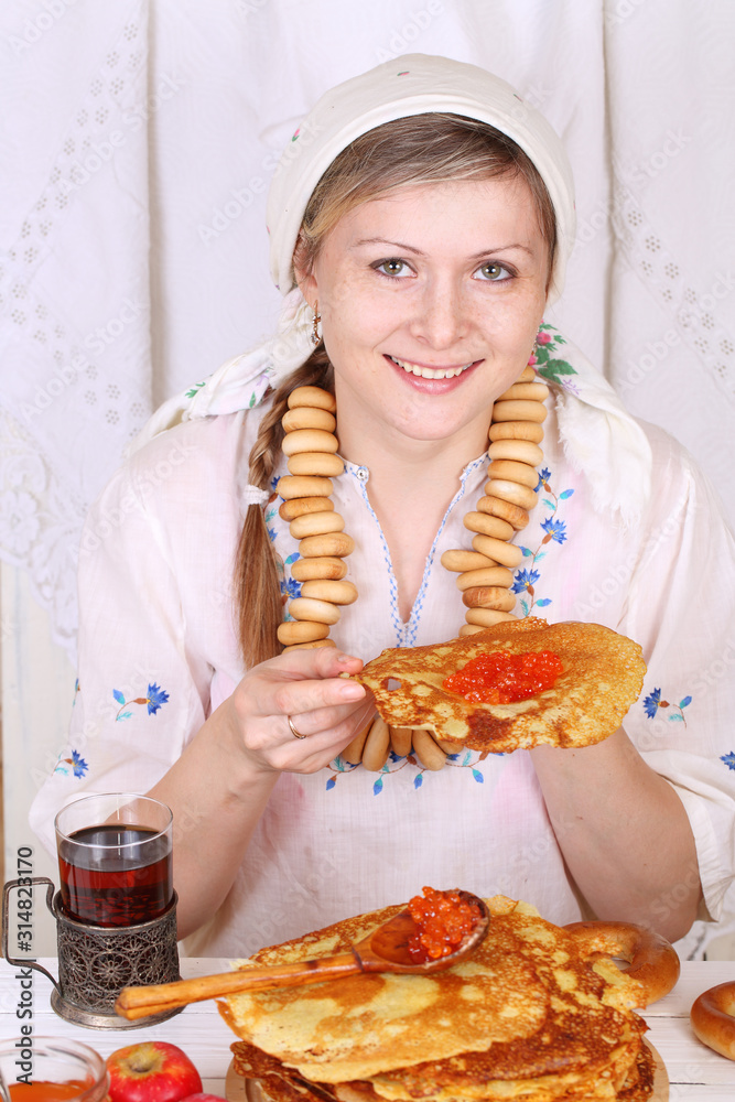 Beautiful girl in Russian attire. Maslenitsa