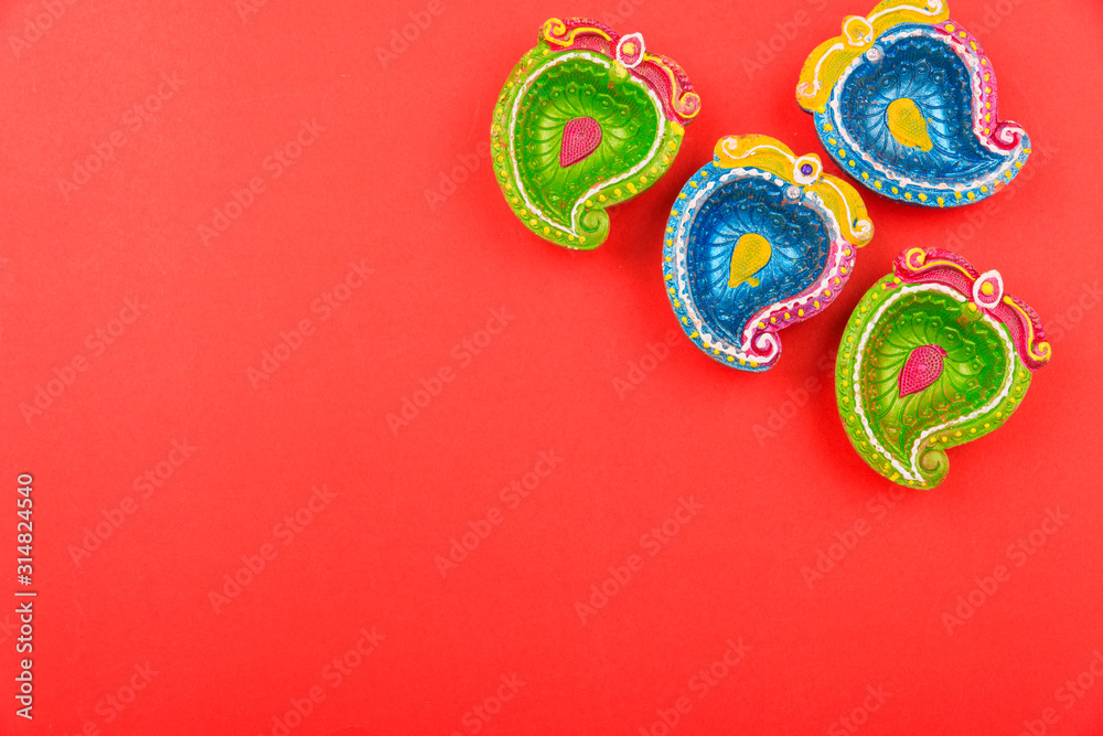 Happy Diwali Day, Flat lay top view Colorful Clay Diya lamps Happy Diwali Day, Flat lay top view Colorful Clay Diya lamps