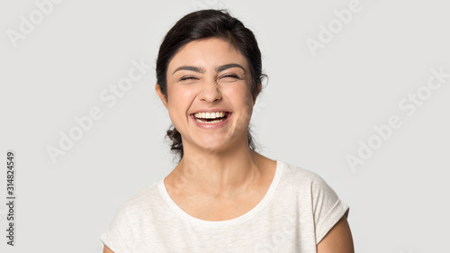 Millennial funny attractive indian ethnicity woman feeling excited.