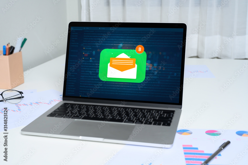 Person using a laptop computer with email communication connection message online and chat on social media with global letters concept. Laptop mockup with clipping path on screen. Person using a laptop computer with email communication connection message online and chat on social media with global letters concept. Laptop mockup with clipping path on screen.