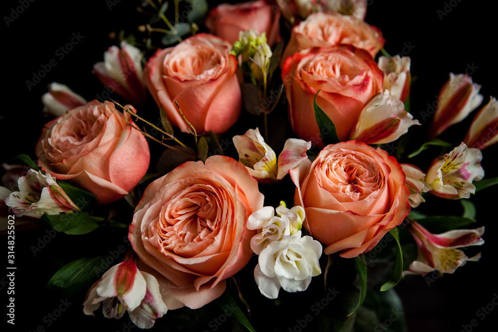 dark luxurious bouquet of gorgeous pink roses for Valentine's day on a dark wood background dark luxurious bouquet of gorgeous pink roses for Valentine's day on a dark wood background