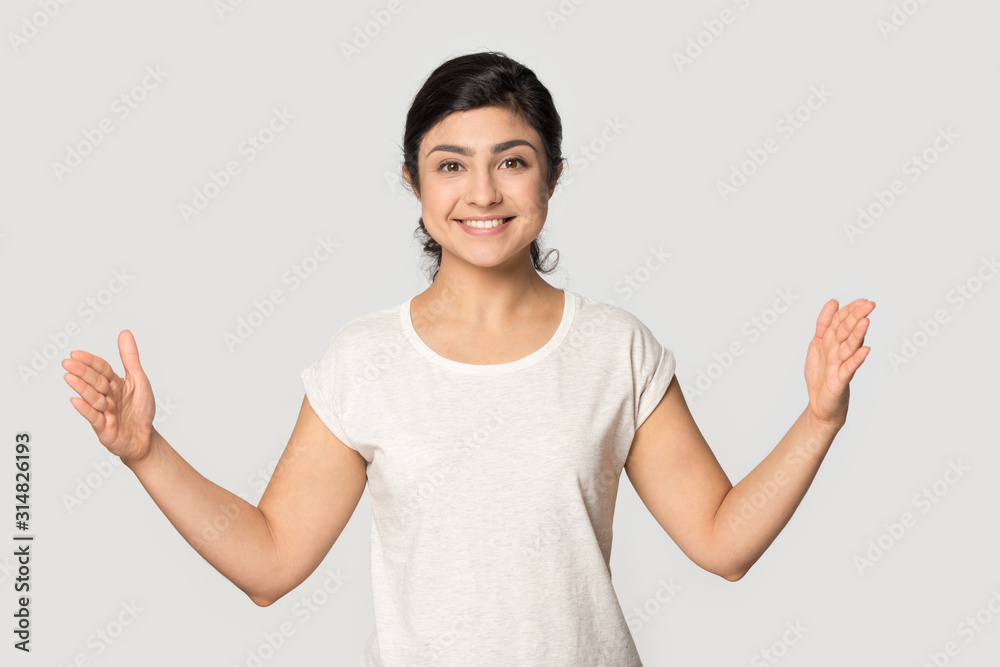 Smiling female indian ethnicity customer satisfied with big product discounts. Smiling female indian ethnicity customer satisfied with big product discounts.