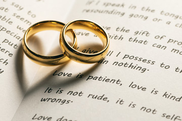 Golden wedding rings on bible book