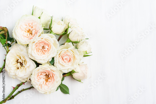 Beautiful white roses flower bouquet on white table