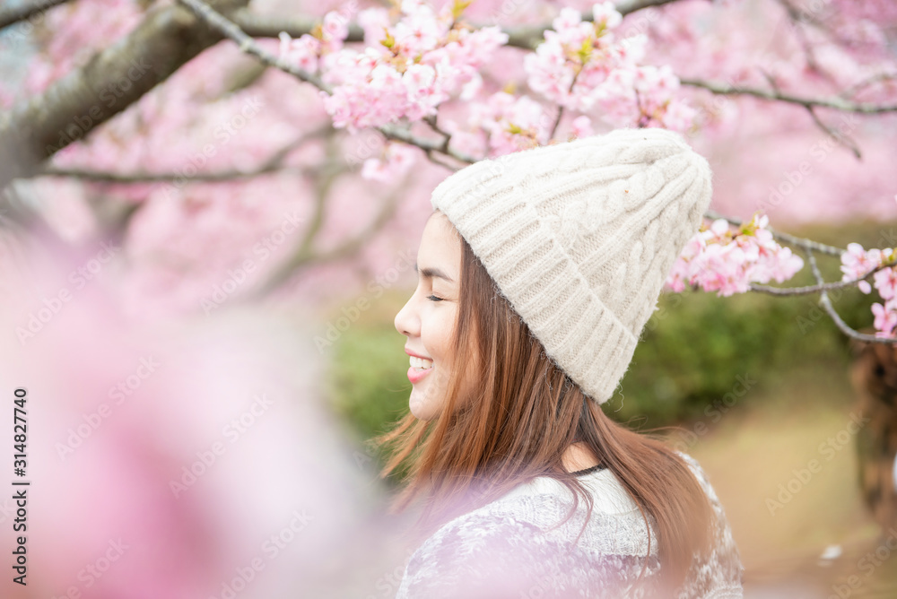 Fototapeta premium Attractive woman is enjoying with Cherry Blossom in Matsuda , Japan