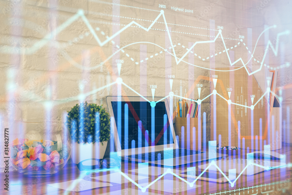 Financial graph colorful drawing and table with computer on background. Double exposure. Concept of international markets. Financial graph colorful drawing and table with computer on background. Double exposure. Concept of international markets.