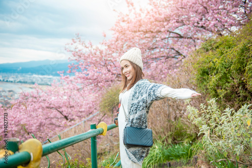 Attractive woman is enjoying  with  Cherry Blossom in Matsuda , Japan