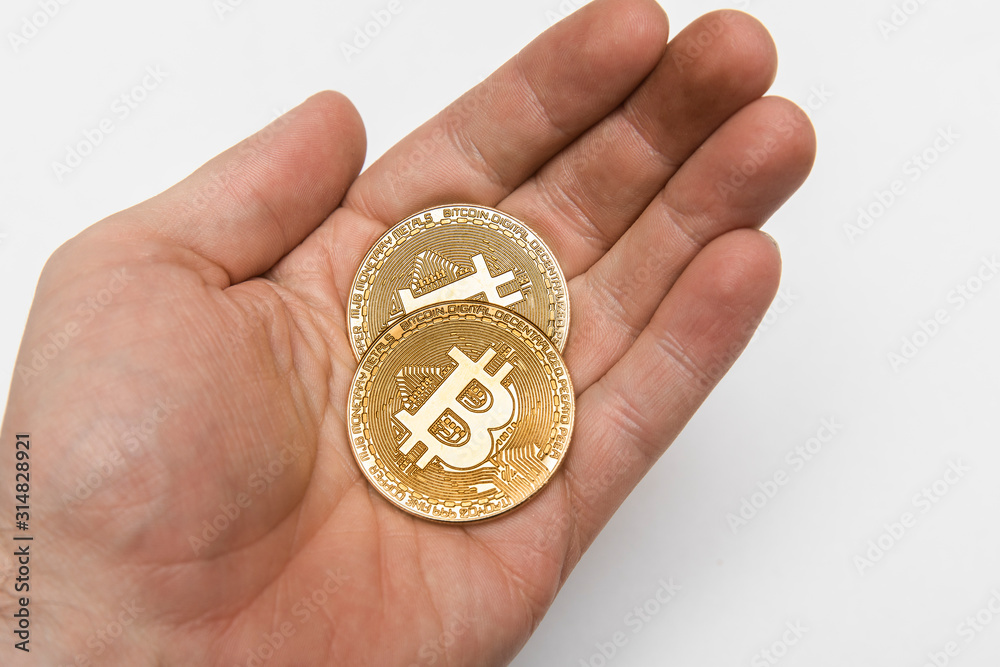 Fototapeta premium Bitcoins in a hand