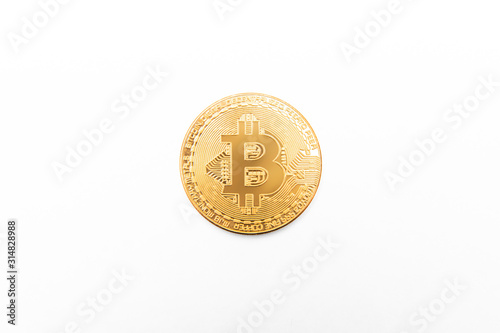 Bitcoin physical gold coin isolated on white © jamenpercy