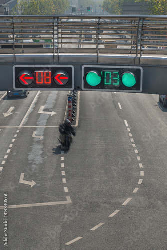 Photography Traffic signal lights on pedestrian overpass over street road