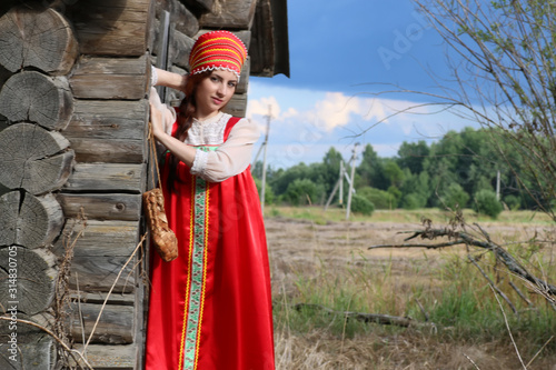 girl in traditional dress wooden wall