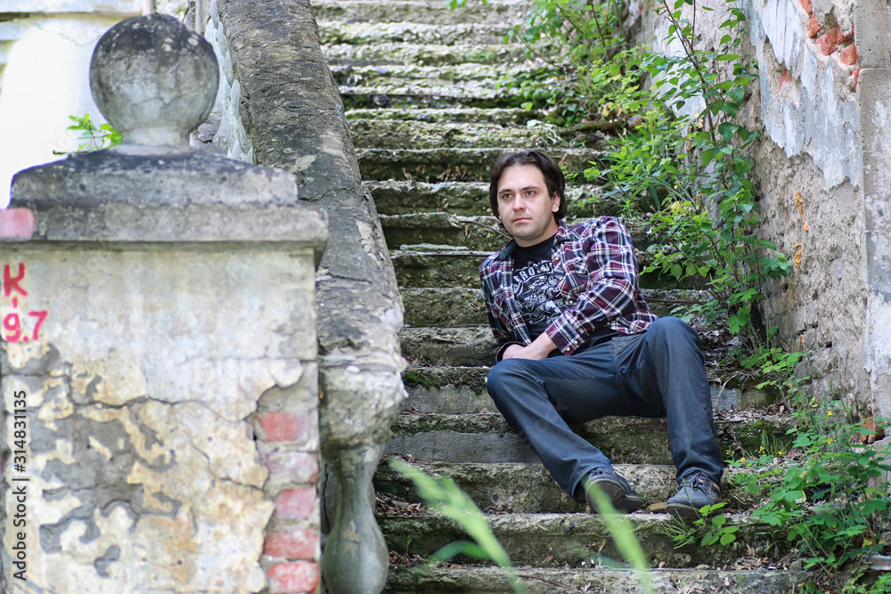 man sit on abandoned stair man sit on abandoned stair